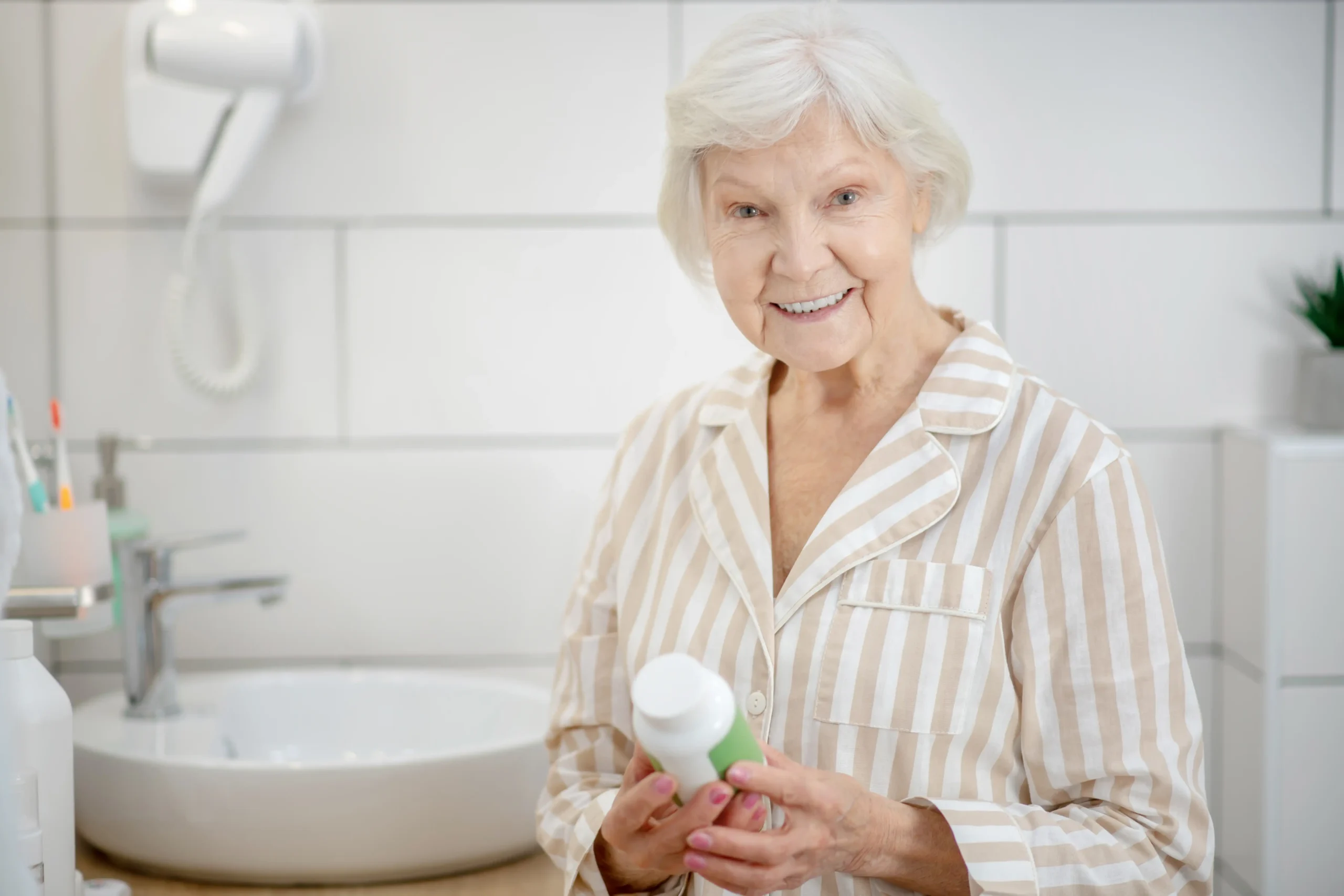 healthcare-woman-pajama-holding-bottle-with-vitamins-her-hands