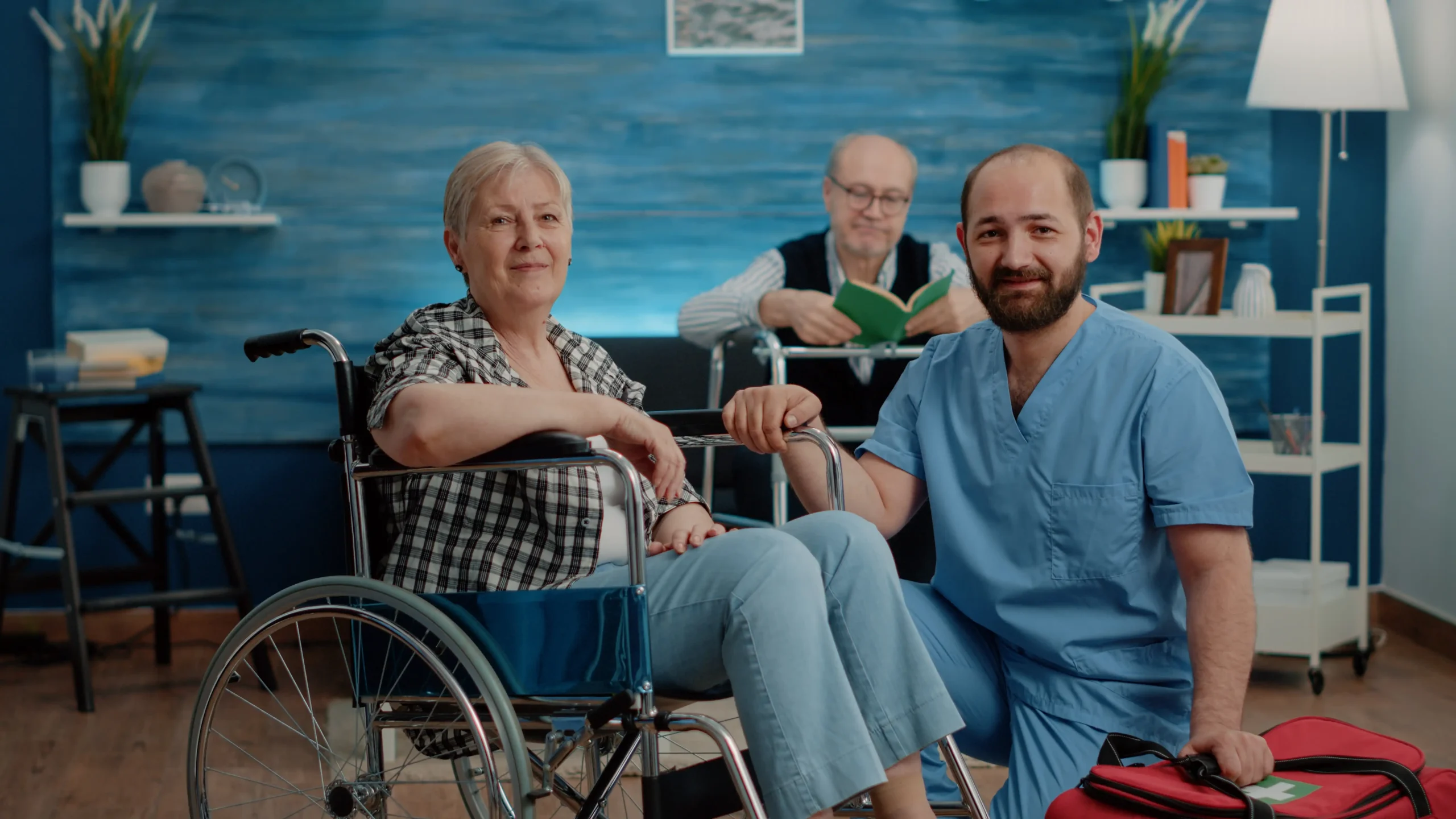 portrait-old-disabled-woman-man-nurse-looking-camera-nursing-home-retired-patient-with-chronic-issues-sitting-wheelchair-while-medical-assistant-preparing-examination